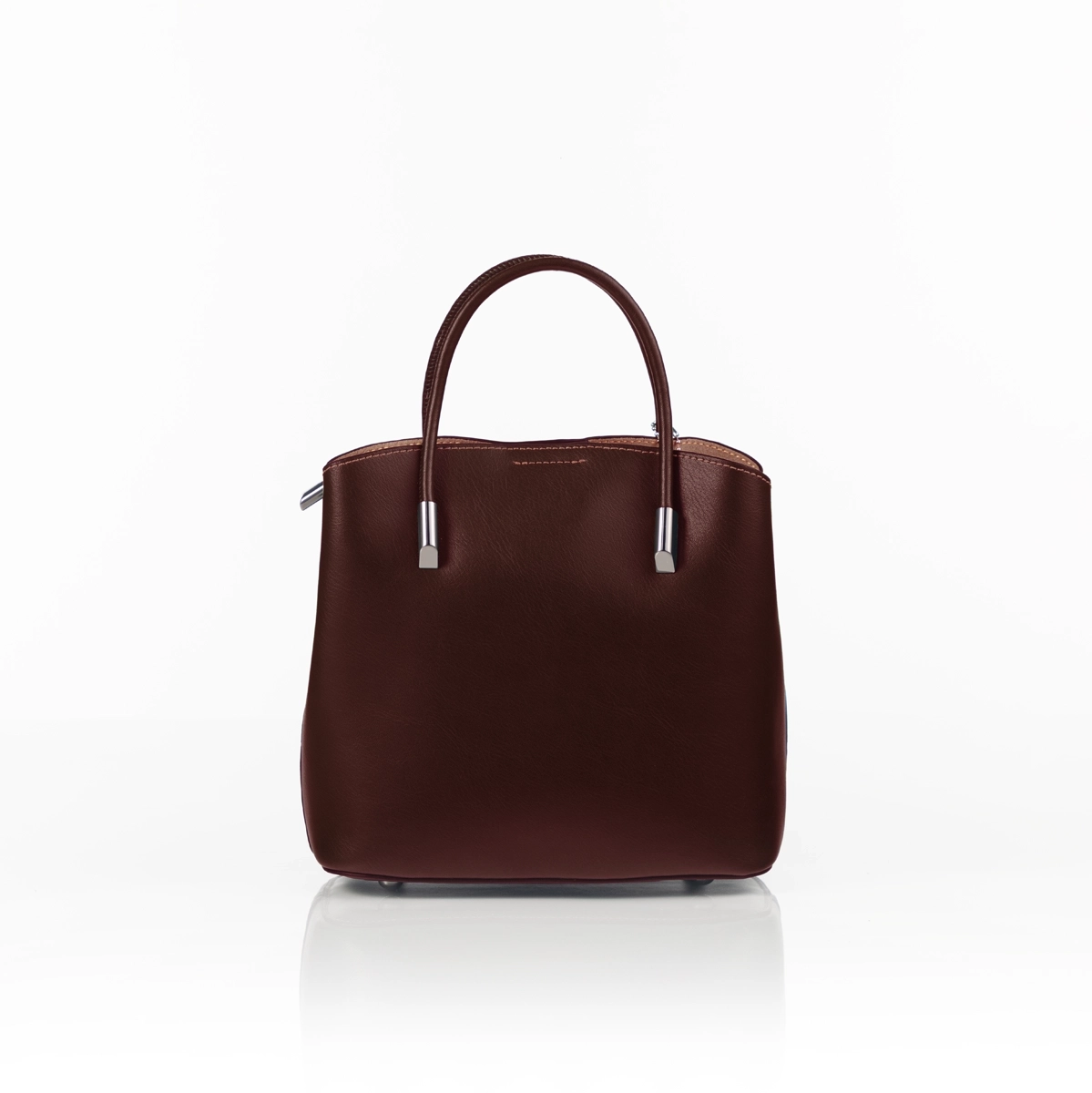 Modern luxury handbag styled for formal setting