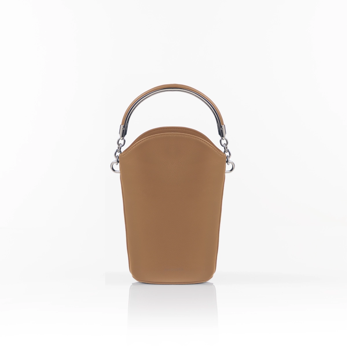 Modern luxury handbag styled for formal setting