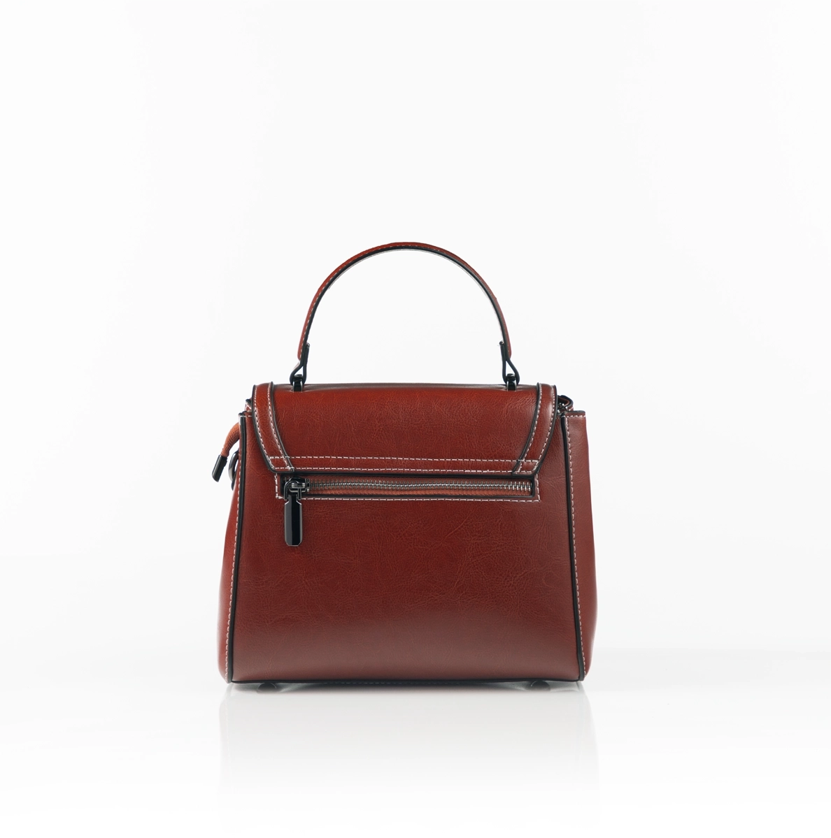 Modern luxury handbag styled for formal setting