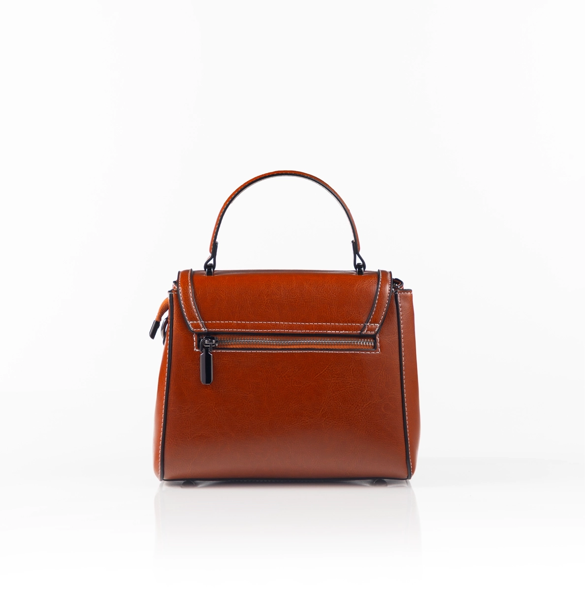 Modern luxury handbag styled for formal setting