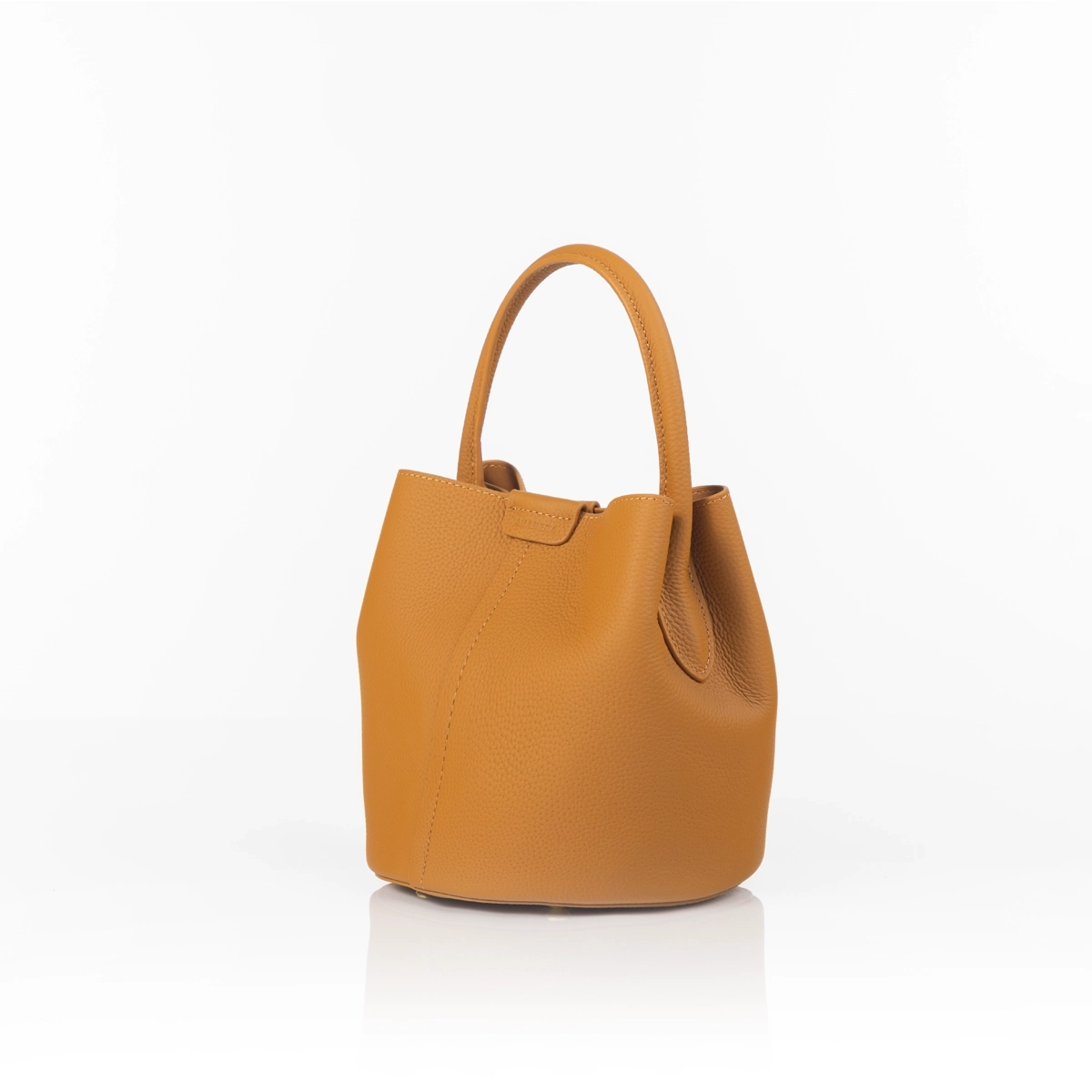 Modern luxury handbag styled for formal setting