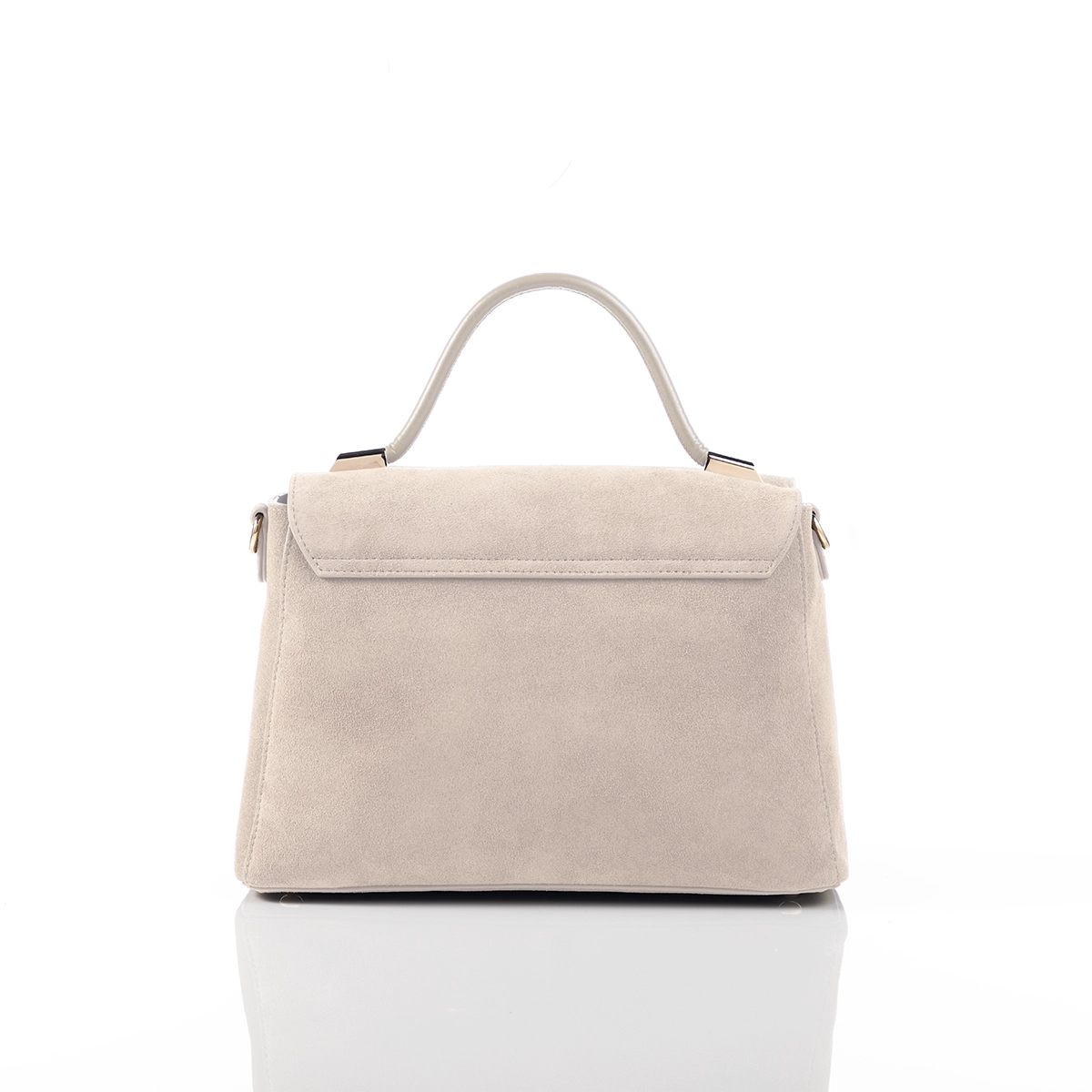 Modern luxury handbag styled for formal setting